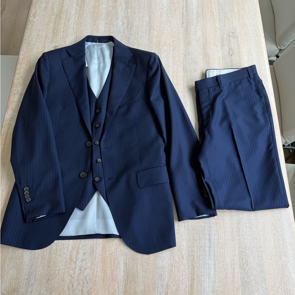 Suitsupply Three-Piece Suit